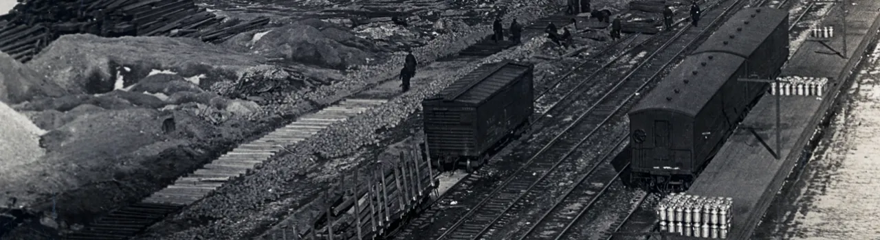 Chapter 4 hero image, black and white photo of train tracks